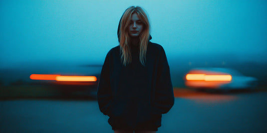 night shift nurse wearing oversized black hoodie outside after work